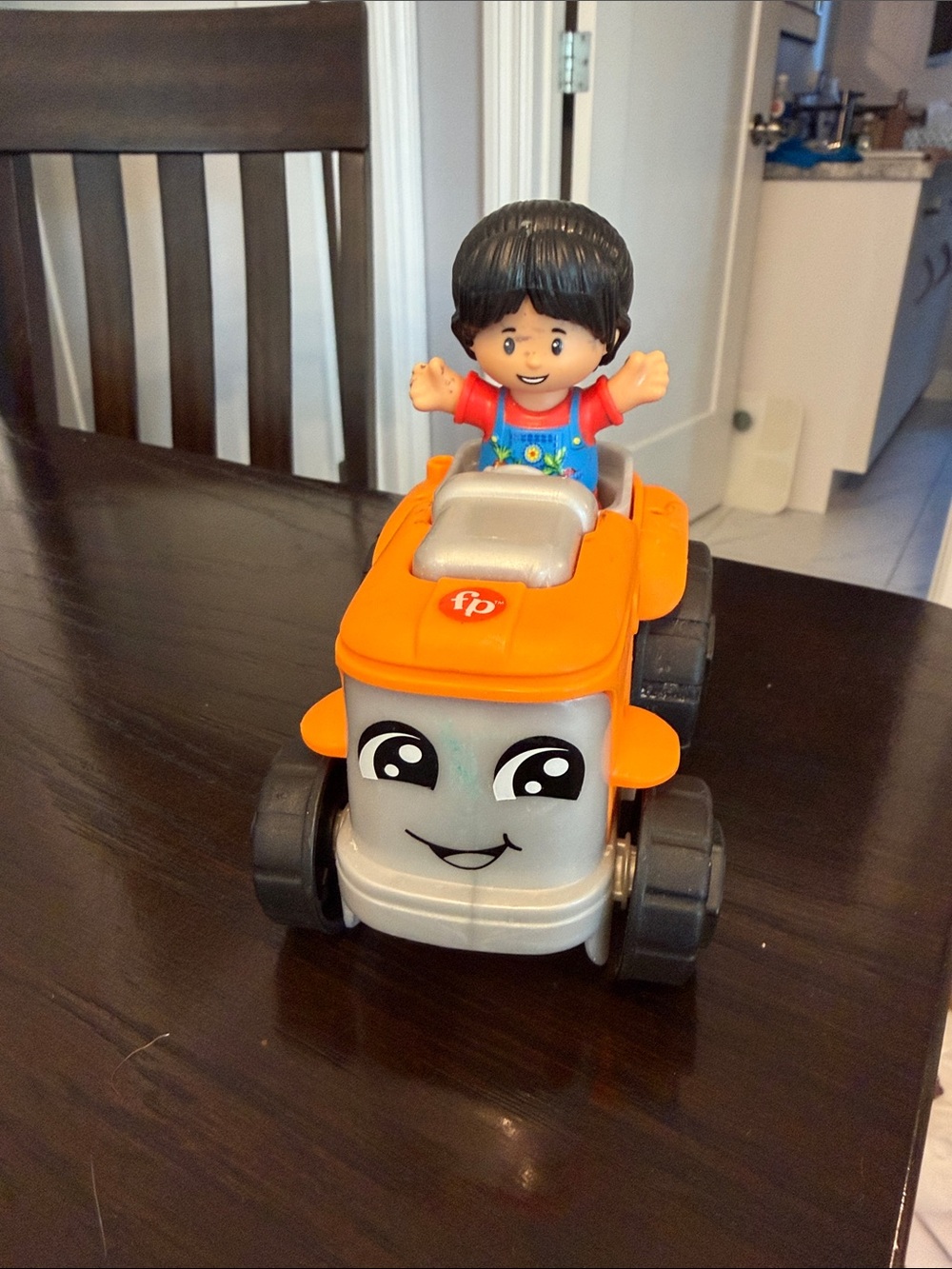 Fisher-Price Orange and Gray Smiling Ride-On Tractor with Figure
